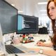 woman-using-computer-monitors