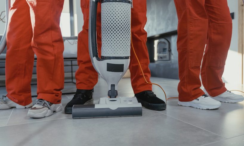people wearing orange overalls